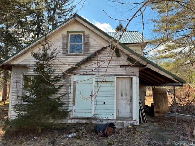 17 Deep Hollow Hill Road Narrowsburg, NY 12764 - Photo 2 of 4 a front view of a house with garden
