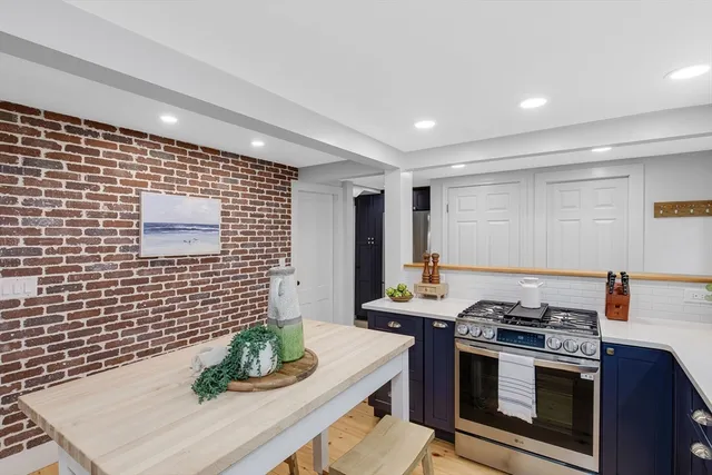 a stove top oven sitting inside of a kitchen