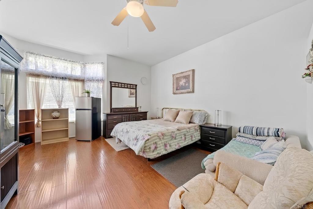 1999 Pecan Tree Street Hemet, CA 92545 - Photo 14 of 38 a bedroom with two beds and painted walls