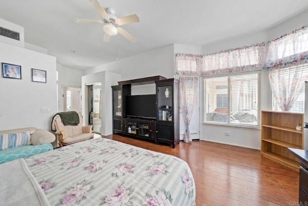 1999 Pecan Tree Street Hemet, CA 92545 - Photo 15 of 38 a bedroom with a bed and a flat screen tv
