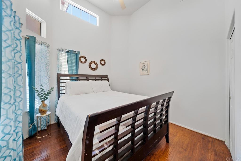 1999 Pecan Tree Street Hemet, CA 92545 - Photo 17 of 38 a bedroom with a bed and wooden floor