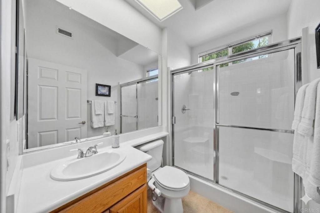 1999 Pecan Tree Street Hemet, CA 92545 - Photo 19 of 38 a bathroom with a sink toilet and shower