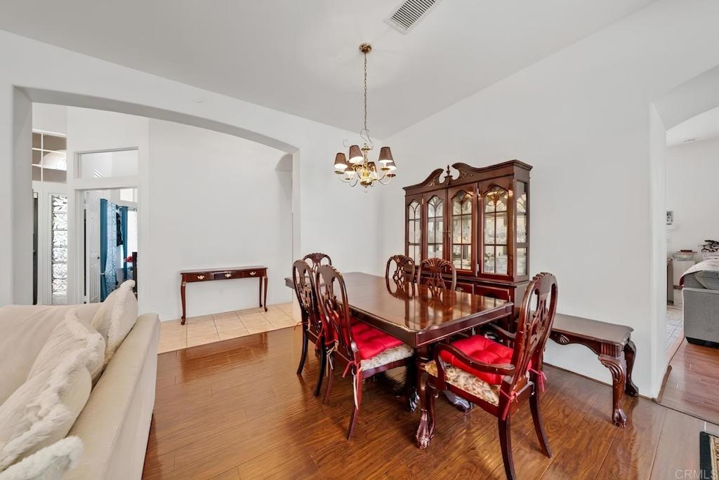 1999 Pecan Tree Street Hemet, CA 92545 - Photo 6 of 38 a view of a dining room with furniture and chandelier