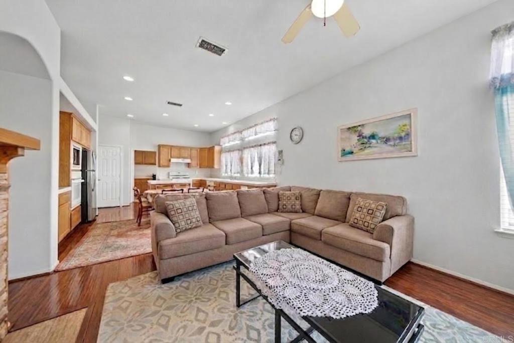1999 Pecan Tree Street Hemet, CA 92545 - Photo 8 of 38 a living room with furniture and a chandelier