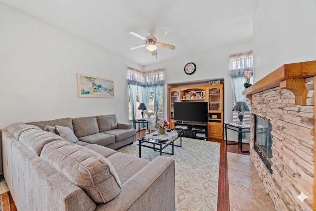 1999 Pecan Tree Street Hemet, CA 92545 - Photo 9 of 38 a living room with furniture and a flat screen tv