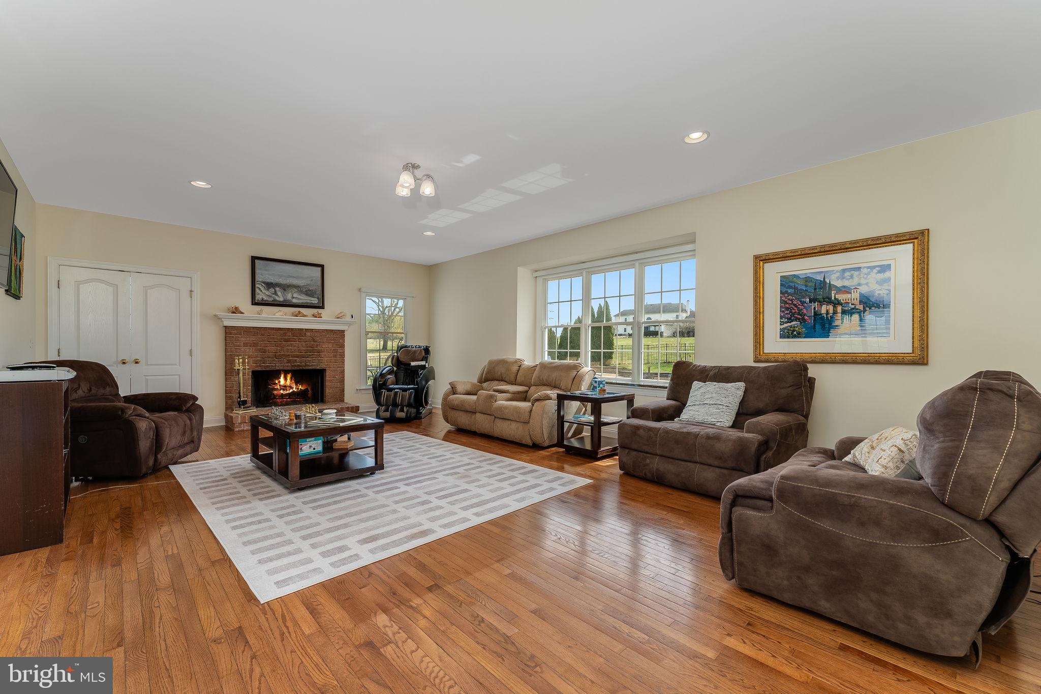 11 Baker Way Pennington, NJ 08534 - Photo 12 of 41 a living room with furniture fireplace and a table