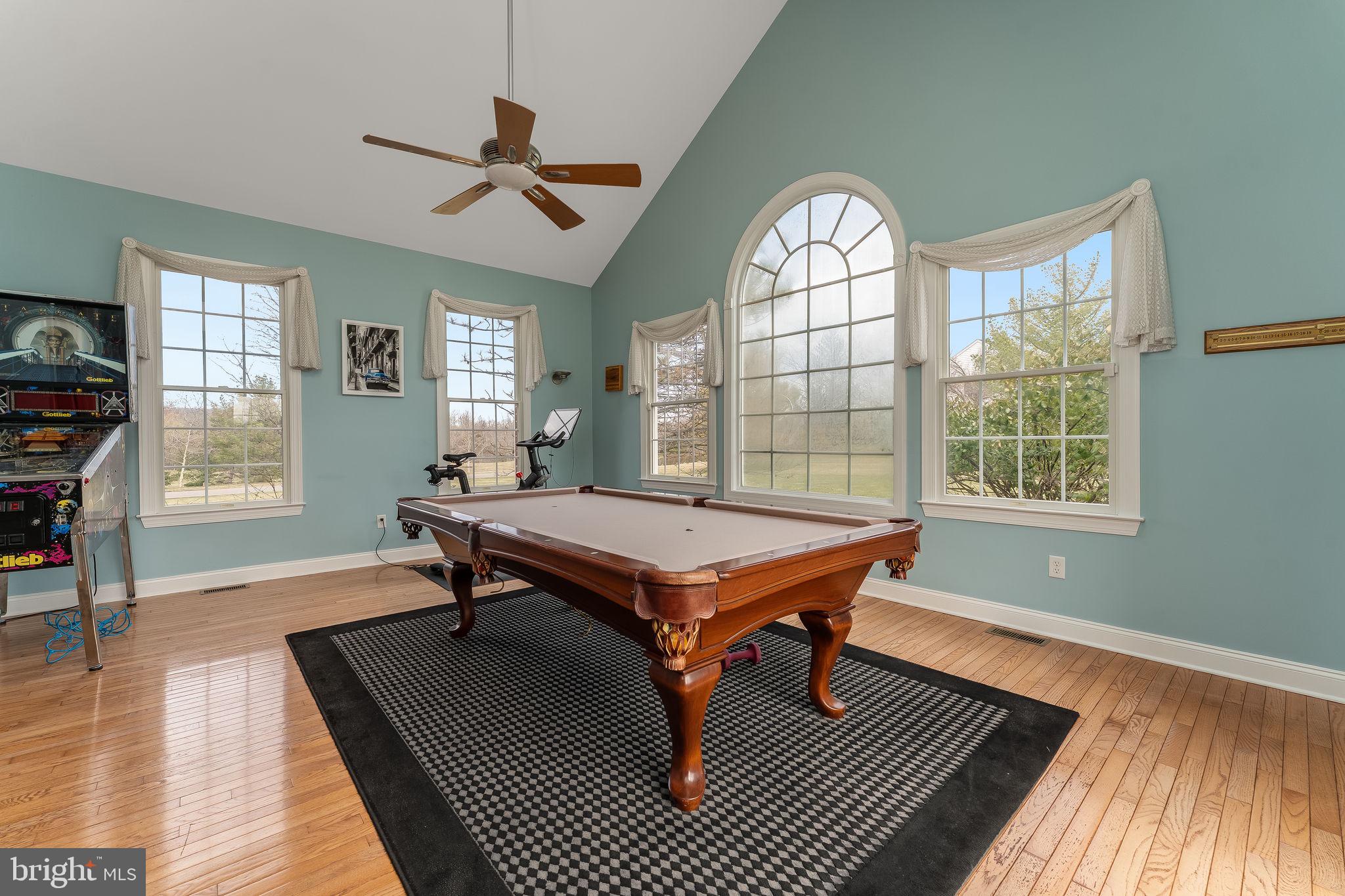 11 Baker Way Pennington, NJ 08534 - Photo 15 of 41 a room with wooden floor pool table and windows