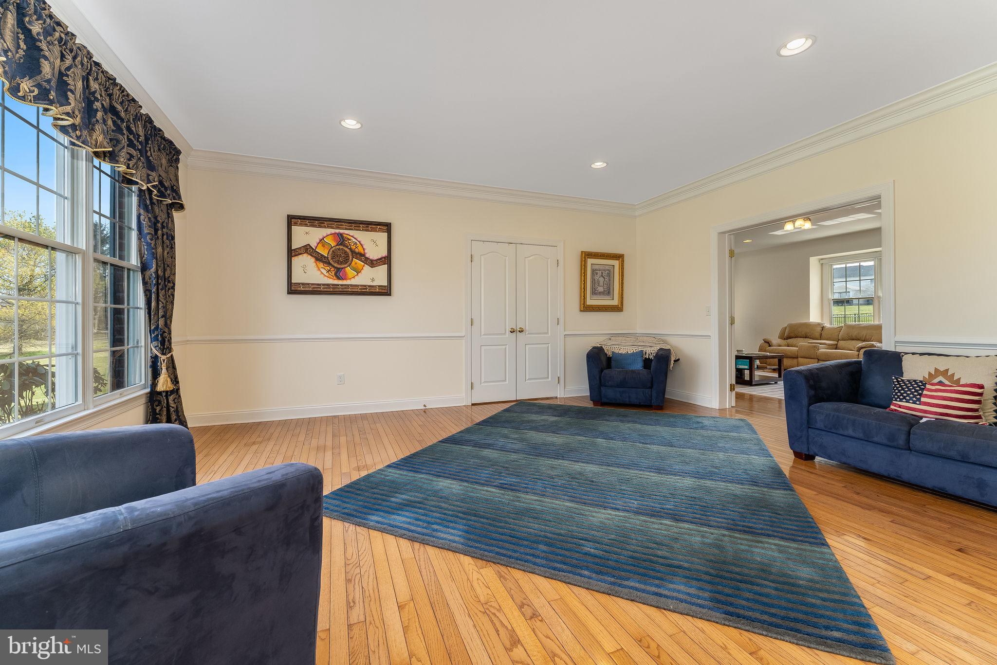 11 Baker Way Pennington, NJ 08534 - Photo 17 of 41 a large bedroom with a bed and wooden floor