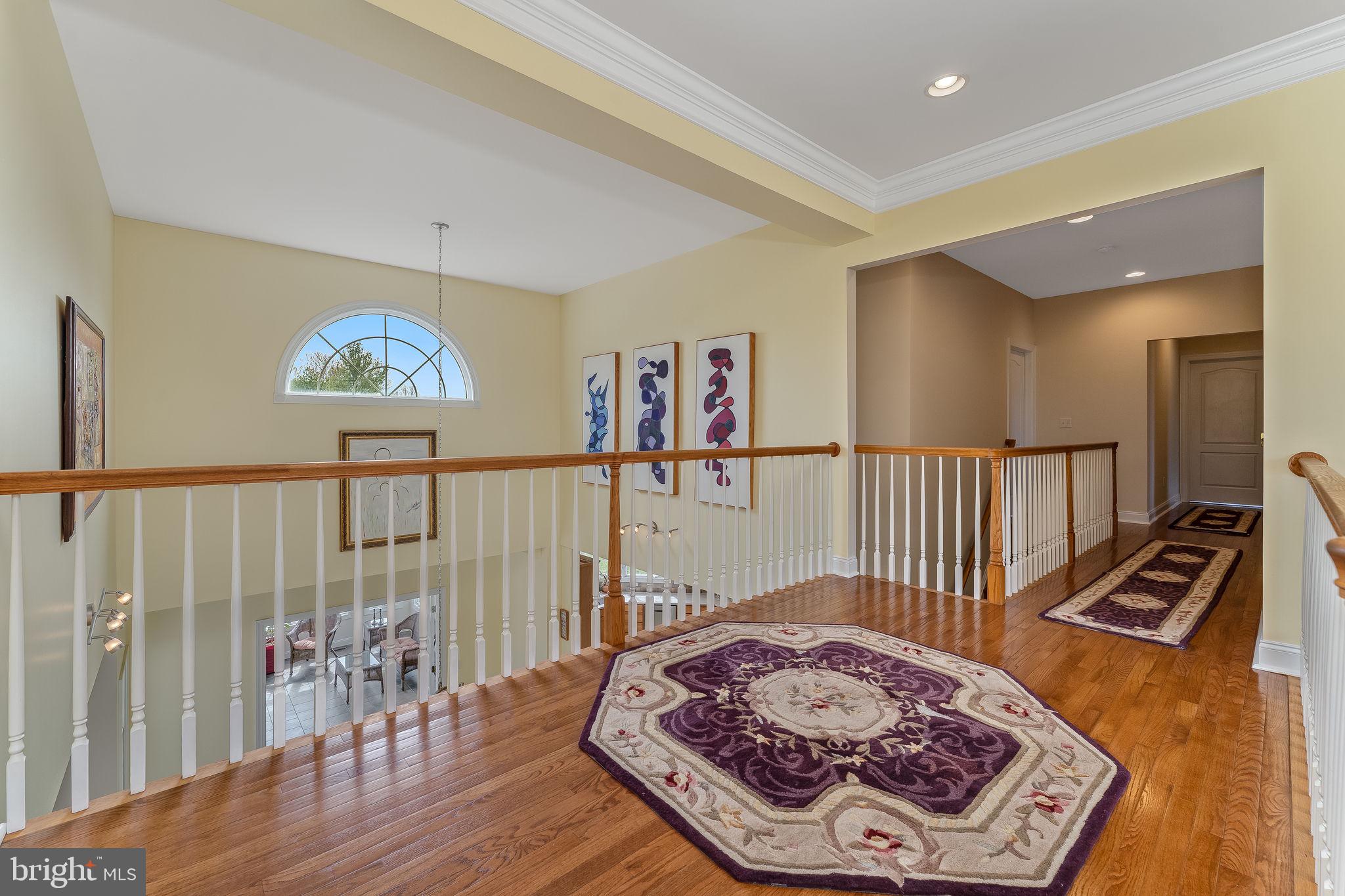11 Baker Way Pennington, NJ 08534 - Photo 21 of 41 a view of a hallway with wooden floor and windows