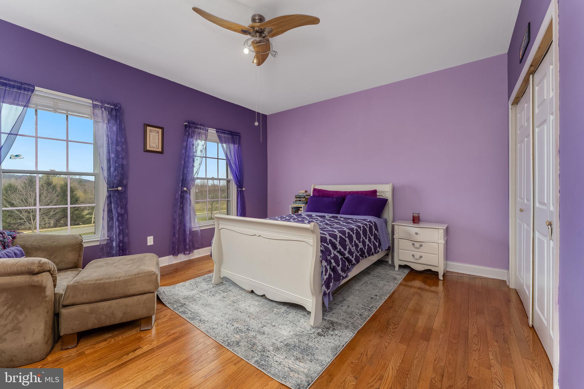 11 Baker Way Pennington, NJ 08534 - Photo 28 of 41 a bedroom with a bed couch and windows