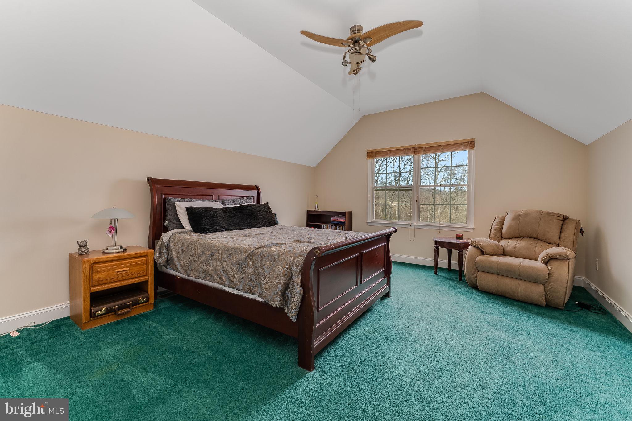 11 Baker Way Pennington, NJ 08534 - Photo 30 of 41 a bedroom with a bed and a couch