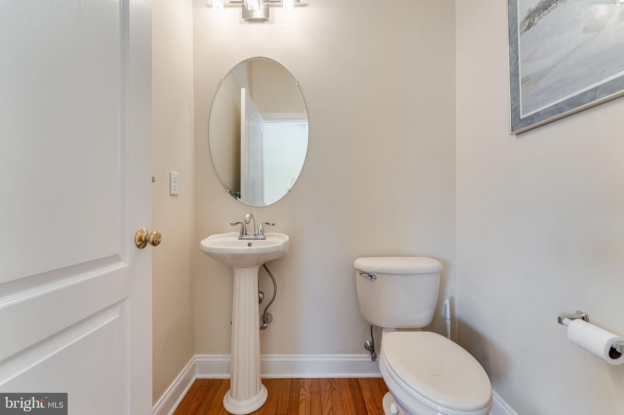 11 Baker Way Pennington, NJ 08534 - Photo 34 of 41 a bathroom with a toilet a sink and a mirror