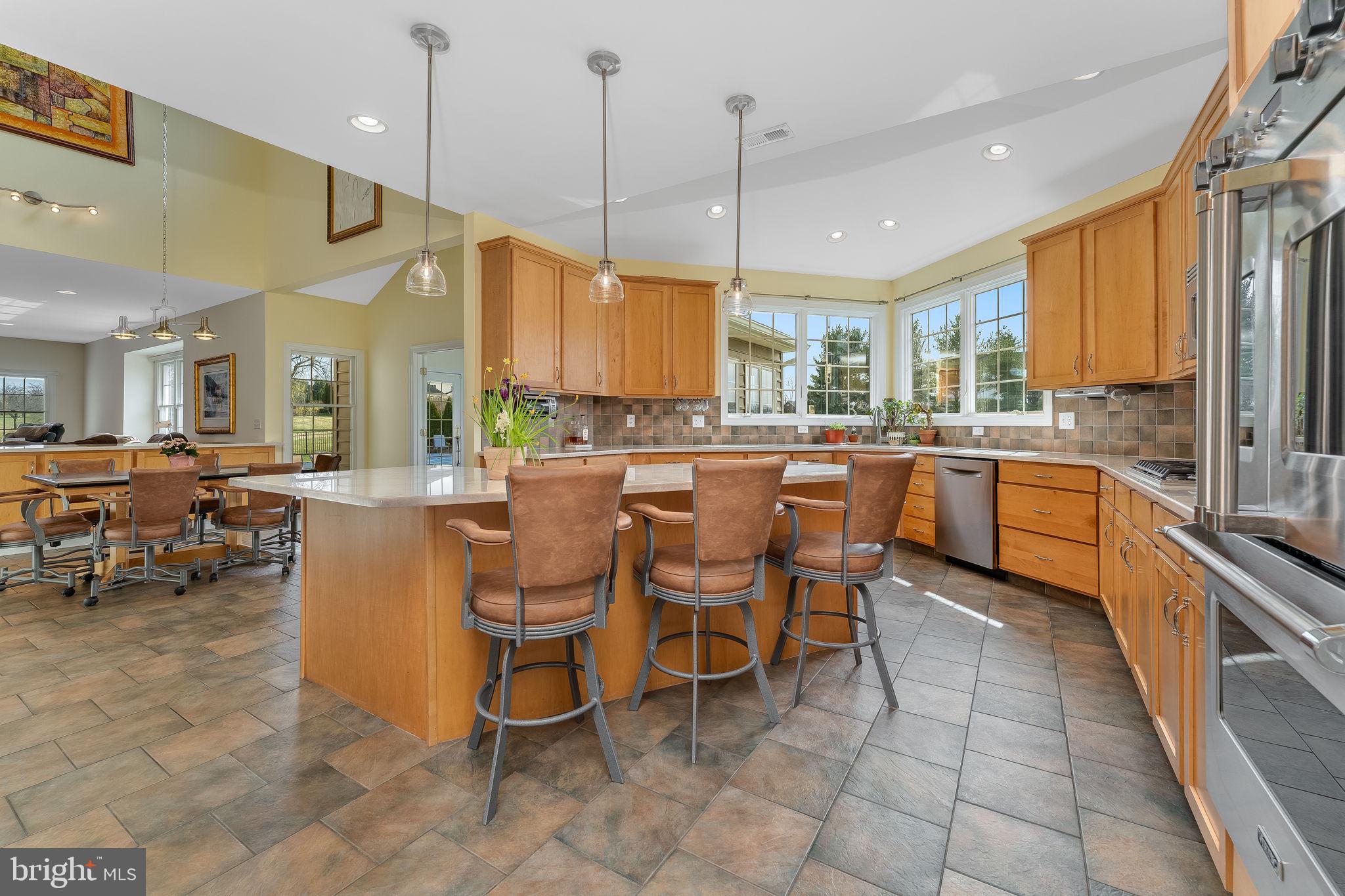 11 Baker Way Pennington, NJ 08534 - Photo 5 of 41 a large kitchen with lots of counter space and furniture