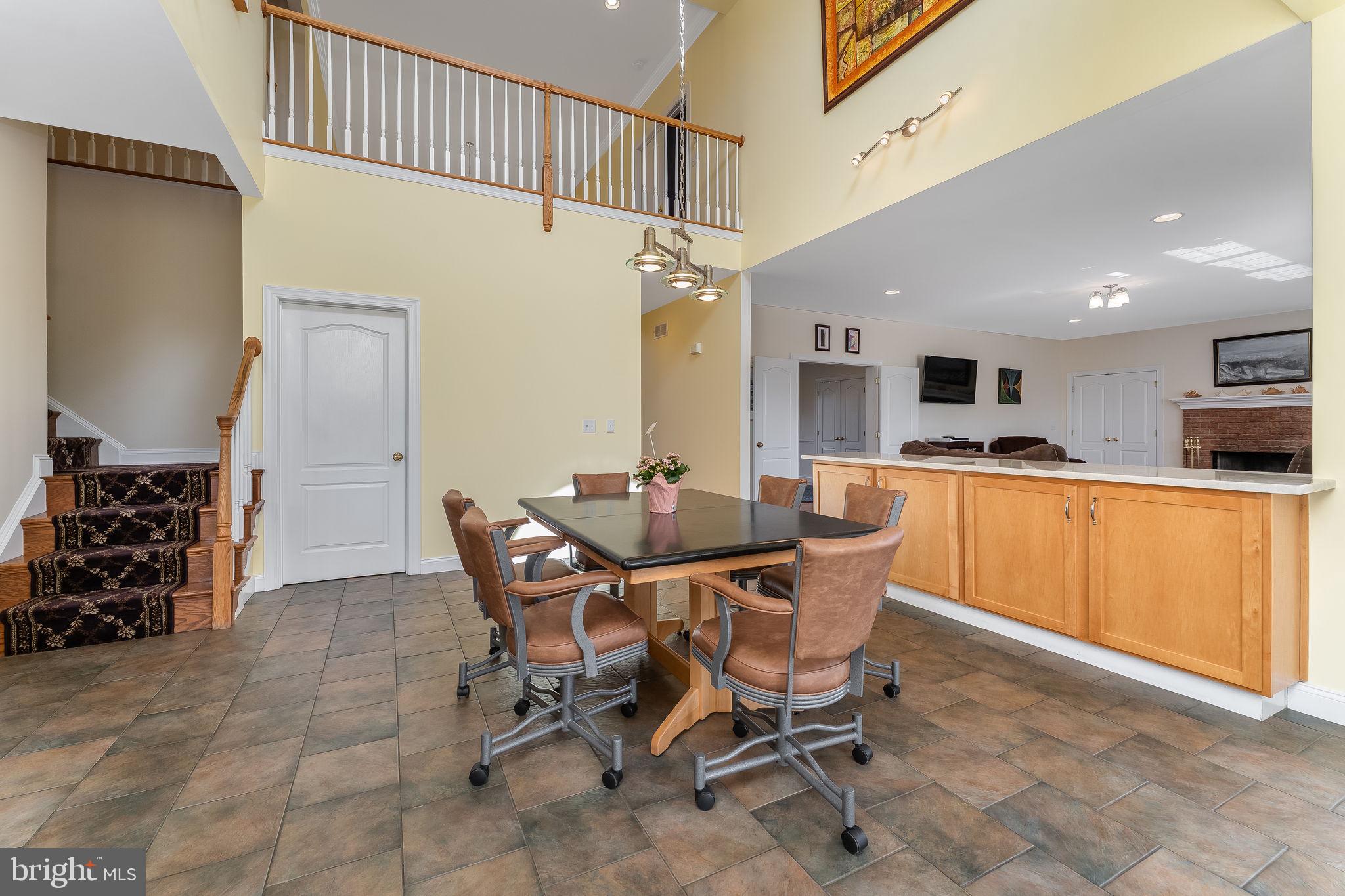 11 Baker Way Pennington, NJ 08534 - Photo 10 of 41 a dining room with furniture and kitchen view