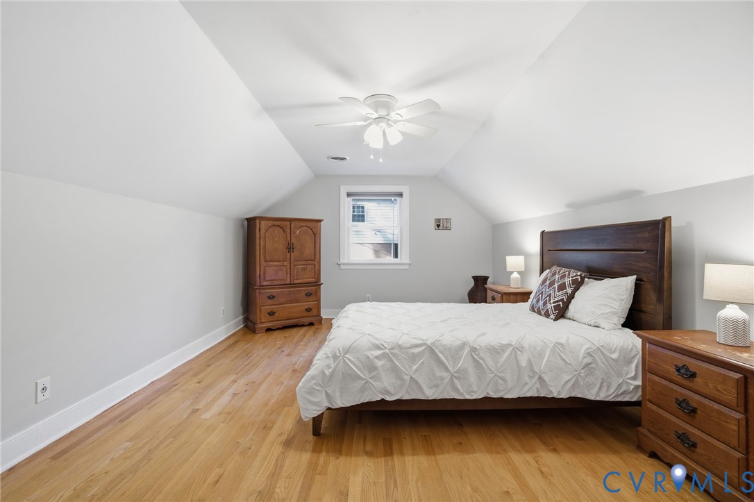 700 Brantley Road North Chesterfield, VA 23235 - Photo 22 of 40 a bedroom with a bed and wooden floor