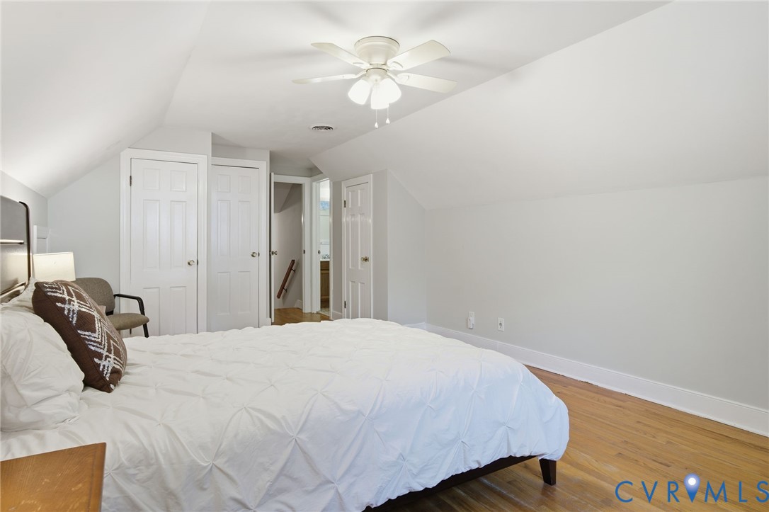700 Brantley Road North Chesterfield, VA 23235 - Photo 23 of 40 a bedroom with a bed and a chandelier