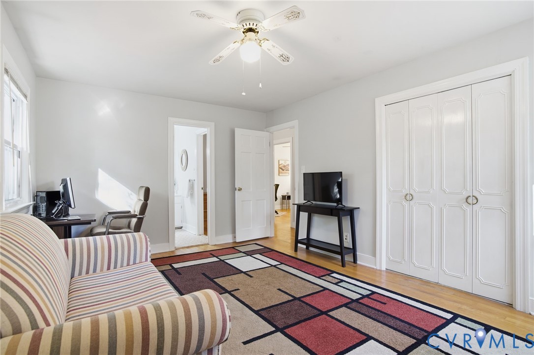 700 Brantley Road North Chesterfield, VA 23235 - Photo 25 of 40 a bedroom with a bed and a chandelier