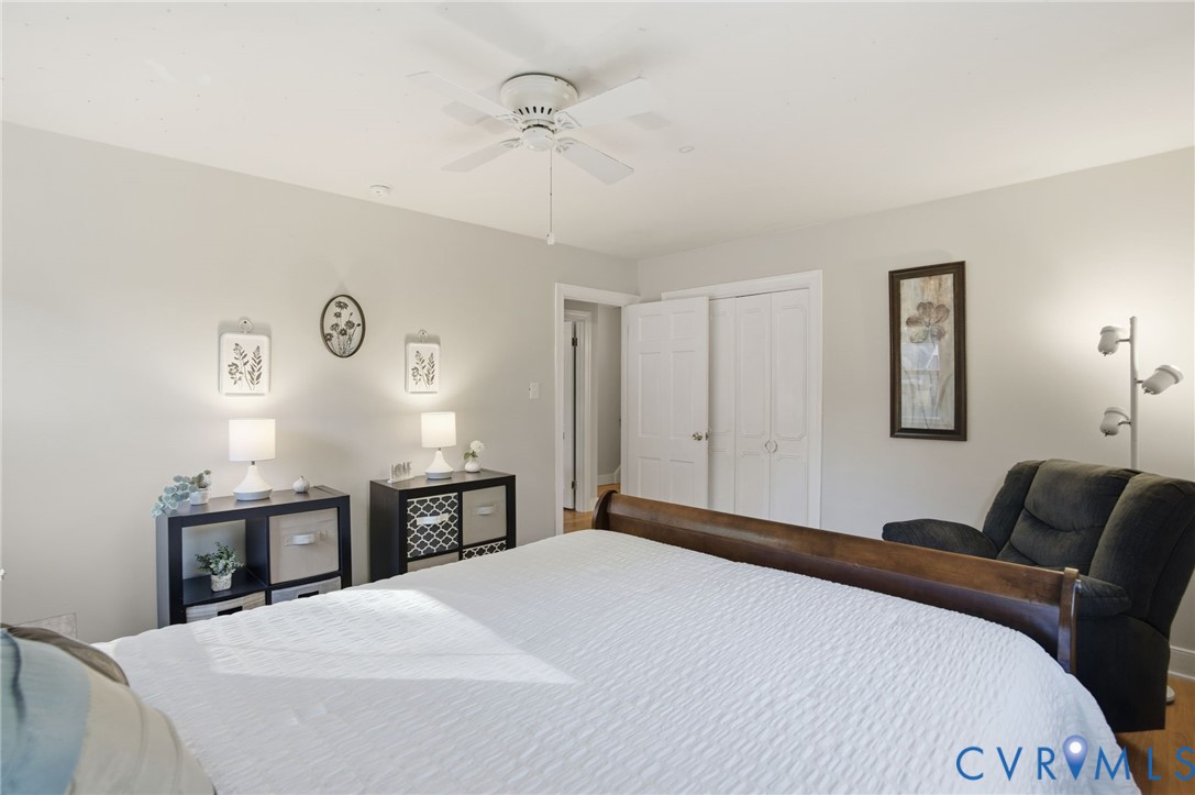 700 Brantley Road North Chesterfield, VA 23235 - Photo 28 of 40 a bedroom with a bed and wooden floor