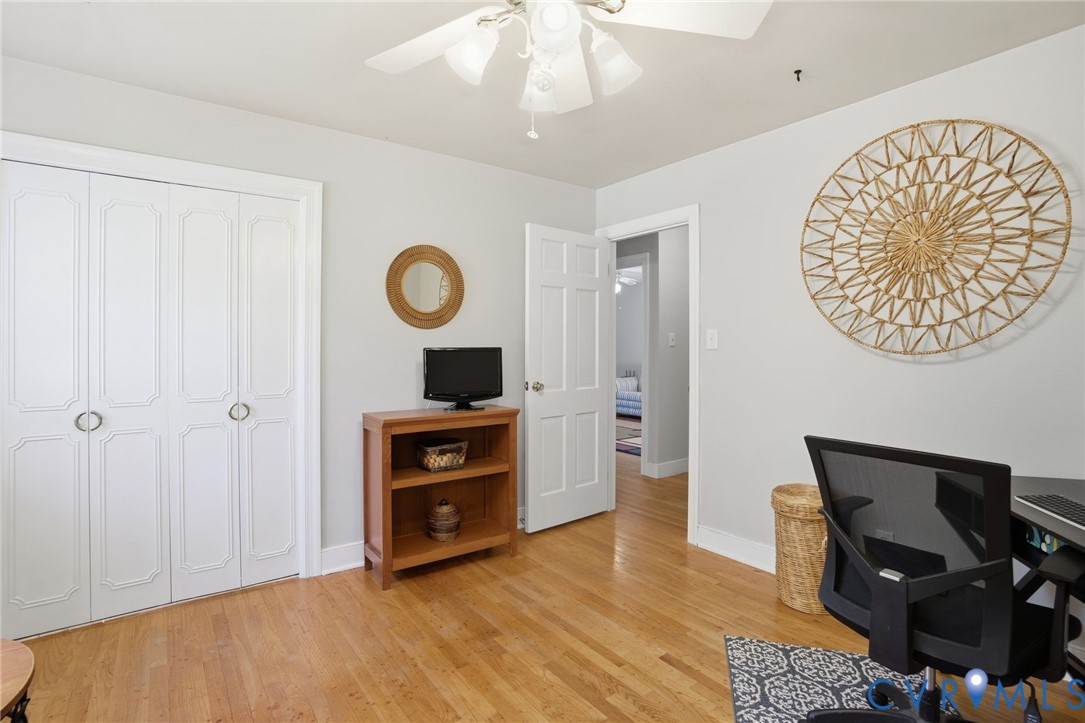 700 Brantley Road North Chesterfield, VA 23235 - Photo 29 of 40 a view of an empty room with kitchen and wooden floor