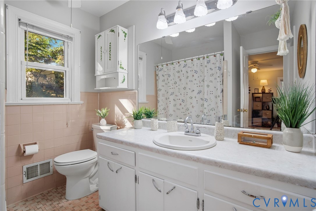 700 Brantley Road North Chesterfield, VA 23235 - Photo 32 of 40 a bathroom with a sink a toilet and a mirror