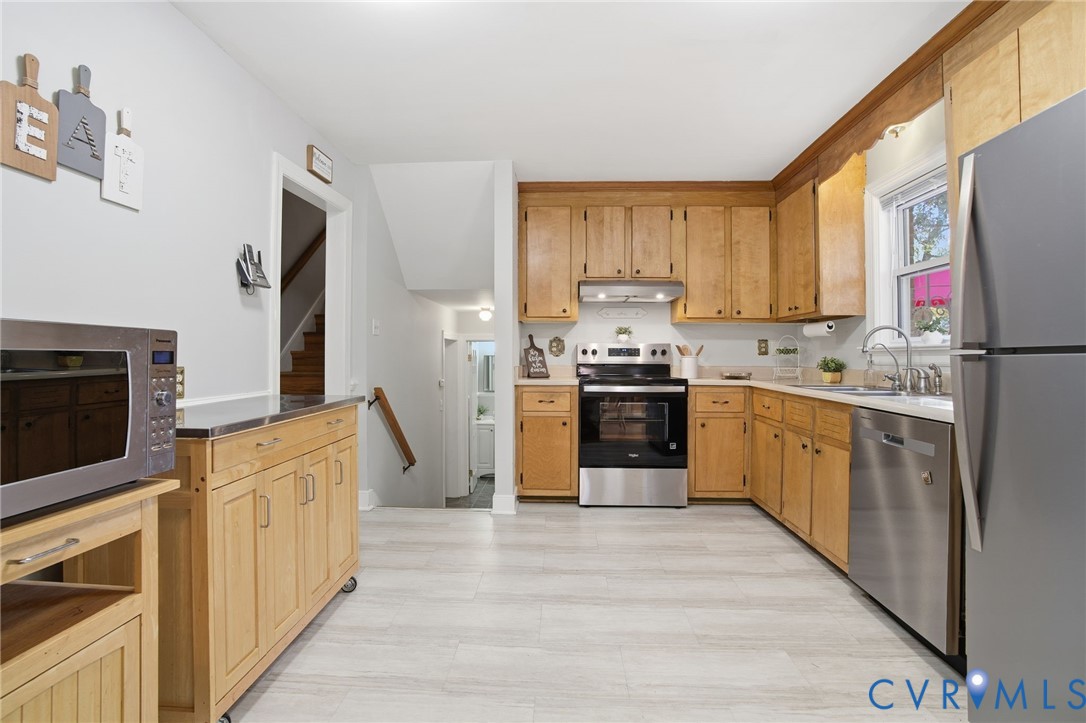 700 Brantley Road North Chesterfield, VA 23235 - Photo 5 of 40 a kitchen with stainless steel appliances granite countertop a stove top oven a refrigerator a sink and dishwasher with white cabinets