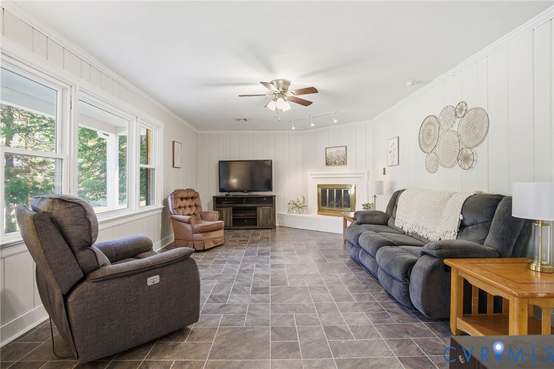 700 Brantley Road North Chesterfield, VA 23235 - Photo 7 of 40 a living room with furniture and a flat screen tv