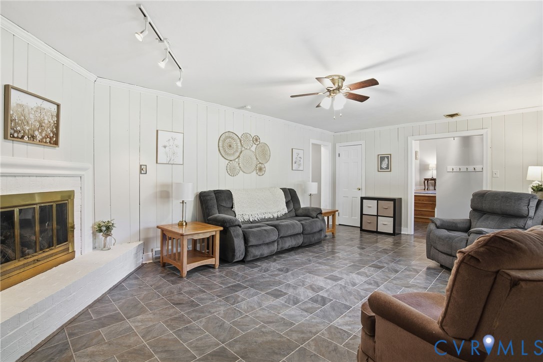 700 Brantley Road North Chesterfield, VA 23235 - Photo 10 of 40 a living room with furniture and a fireplace