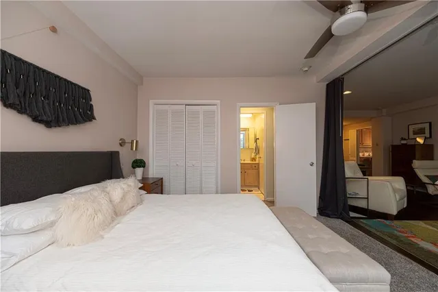 a bedroom with a bed and a couch