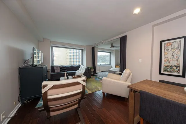 a view of a livingroom with furniture and windows