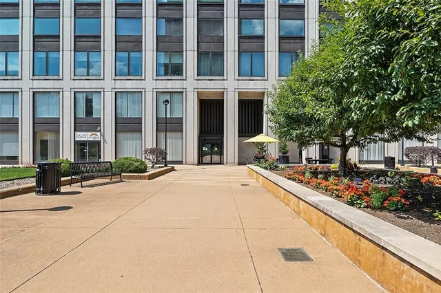 a view of a building with potted plants