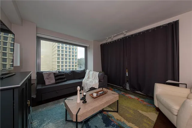 a living room with furniture and a window