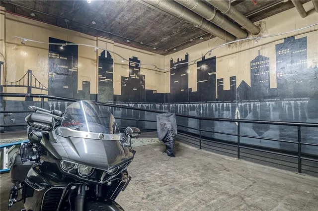 a roof deck with table and chairs