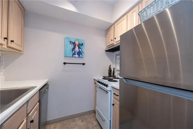 a view of cabinets and wooden floor