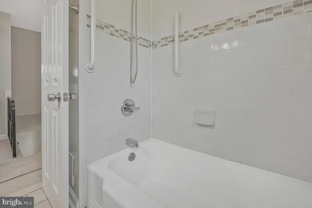 a bathroom with a bath tub
