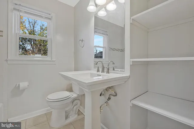 a bathroom with a sink toilet and vanity