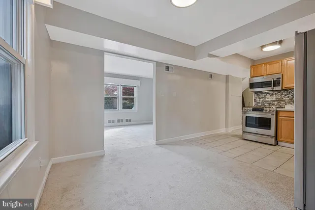 a view of a kitchen with a sink