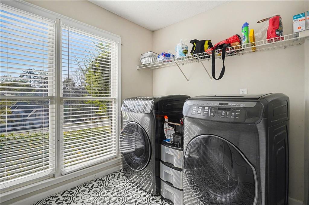570 Morgan Court Hampton, GA 30228 - Photo 21 of 31 a utility room with dryer and washer