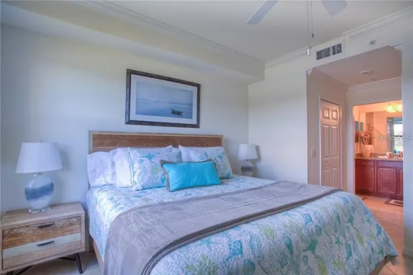 a bedroom with a bed and a view of bathroom