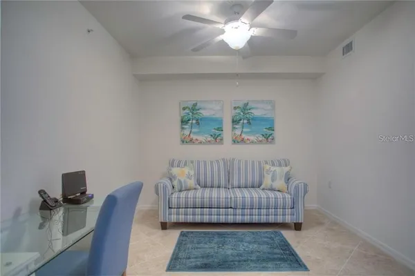 a bedroom with a bed and a rug