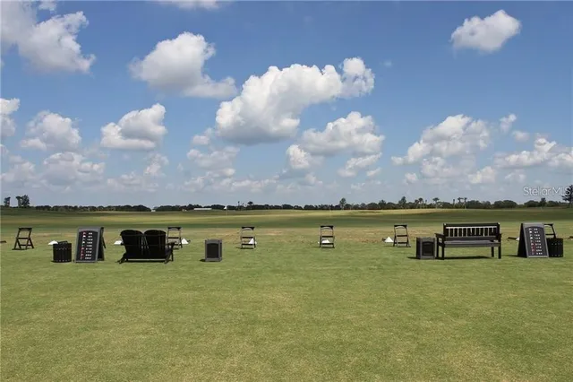 a view of a lake with houses in the back