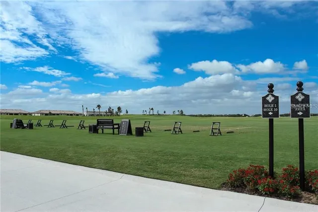 a view of a golf course with a house