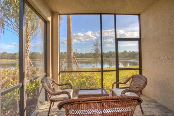 a living room with a couch and a large window
