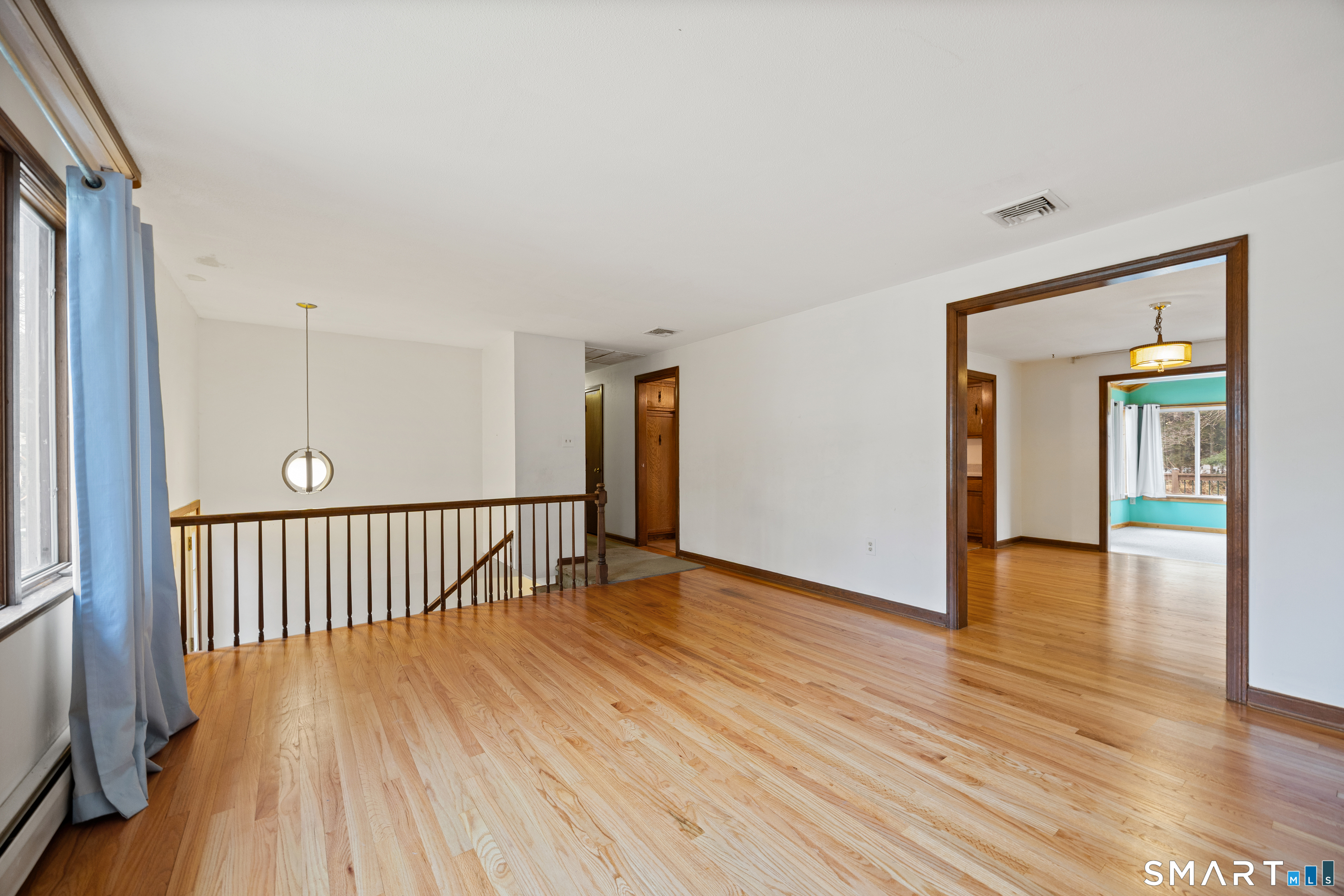60 Roseanna Road Southington, CT 06479 - Photo 13 of 35 a view of an empty room with wooden floor and a window