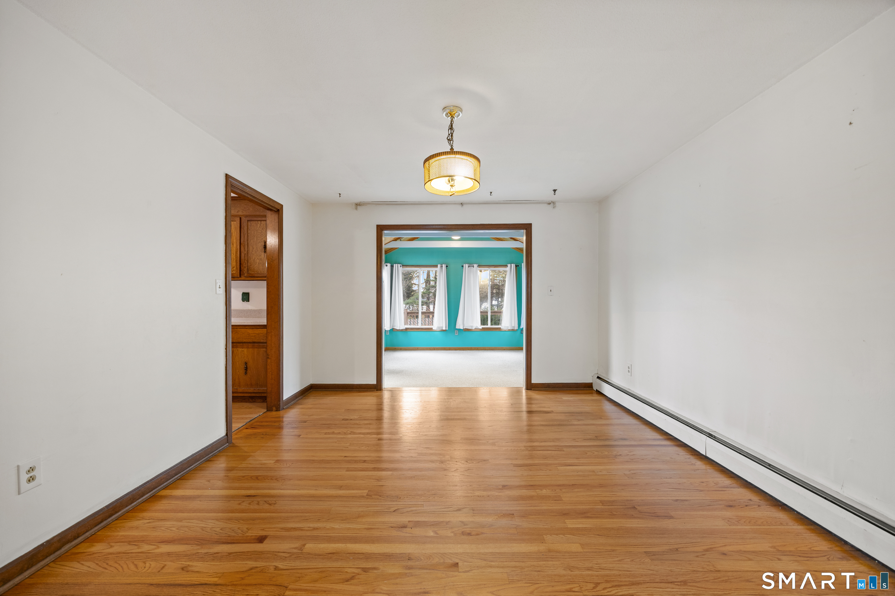 60 Roseanna Road Southington, CT 06479 - Photo 14 of 35 a view of an empty room with window and wooden floor