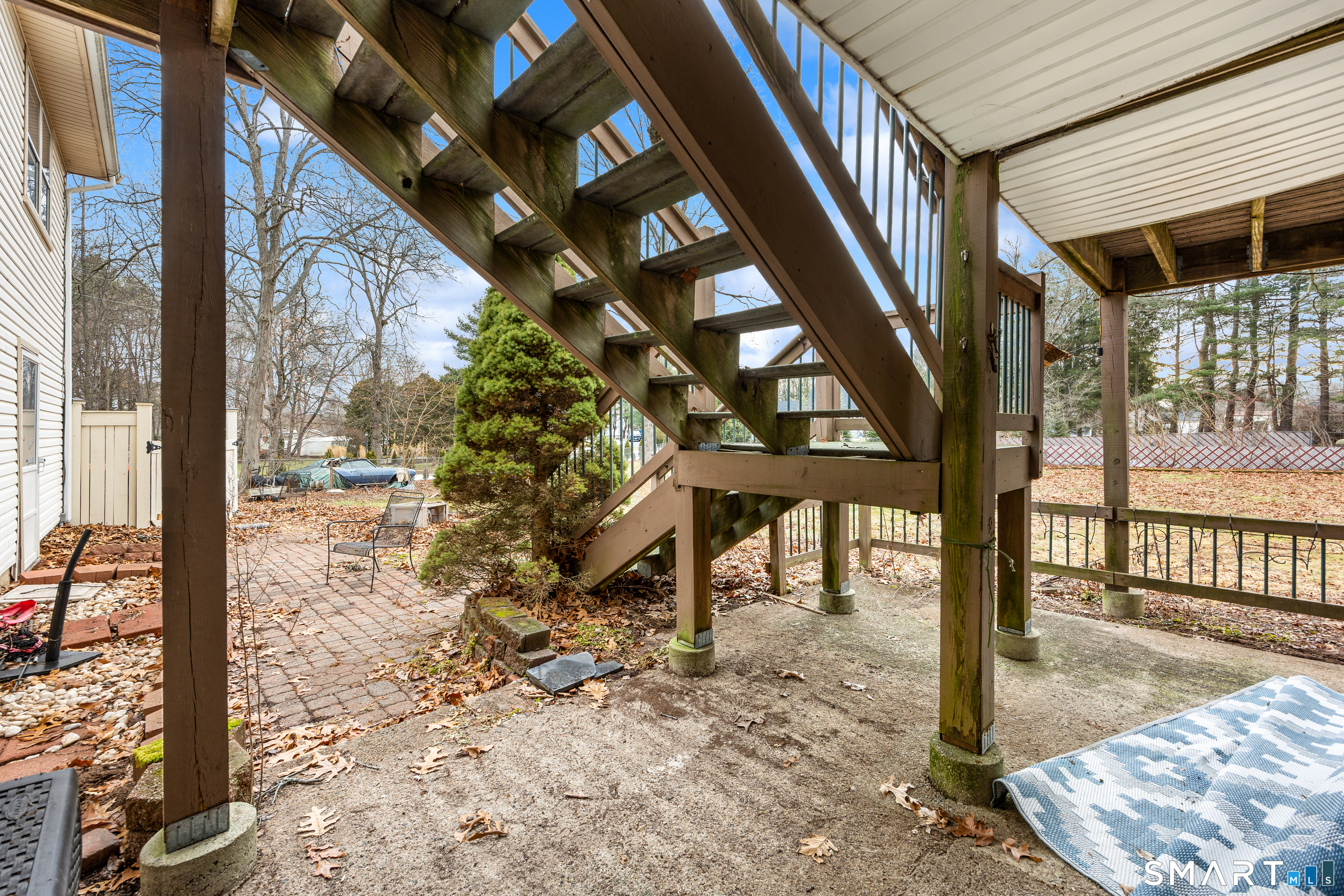 60 Roseanna Road Southington, CT 06479 - Photo 30 of 35 a view of a porch with a bench