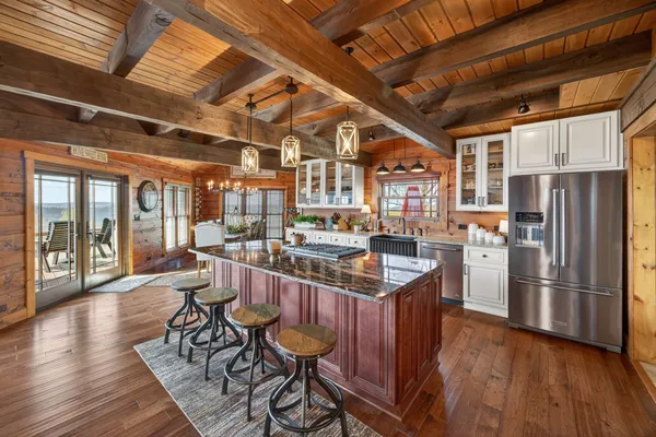 a kitchen with granite countertop lots of counter top space and stainless steel appliances