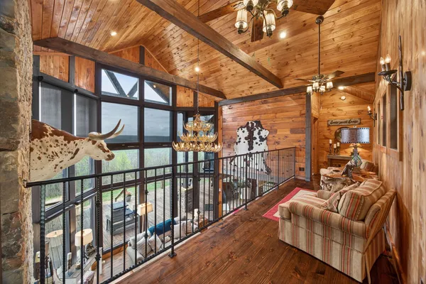 a view of deck with table and chairs with wooden floor