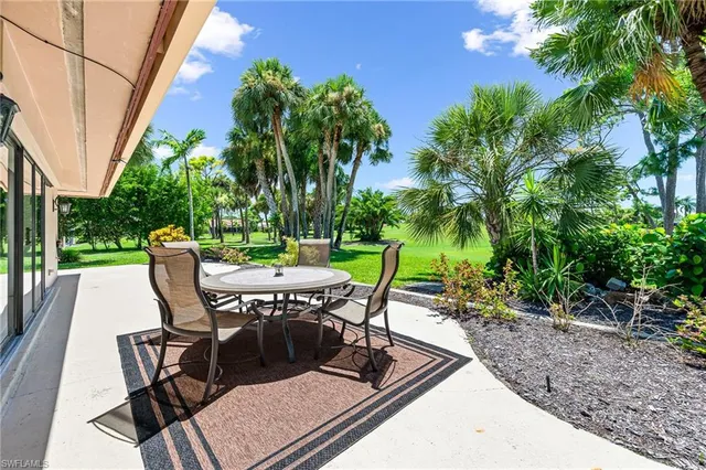 a view of a chairs and table in patio