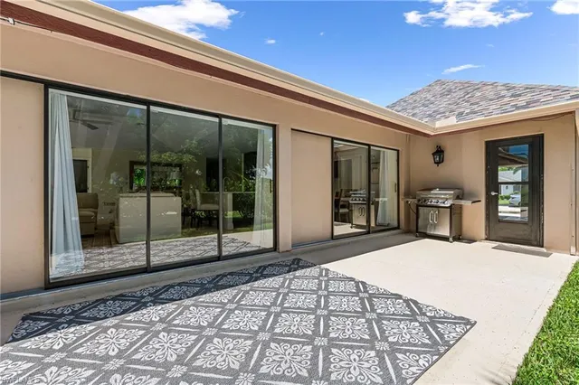 an aerial view of residential houses with outdoor space and swimming pool