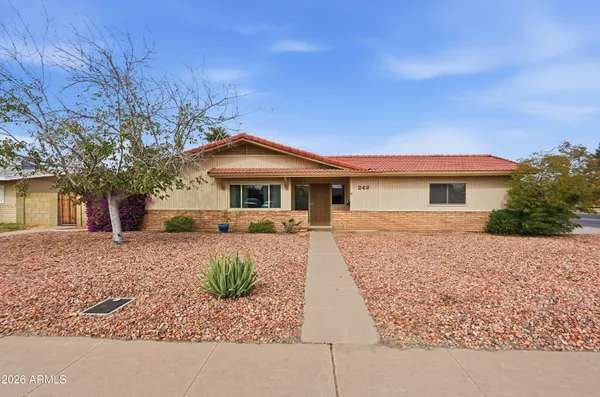 front view of a house with a yard